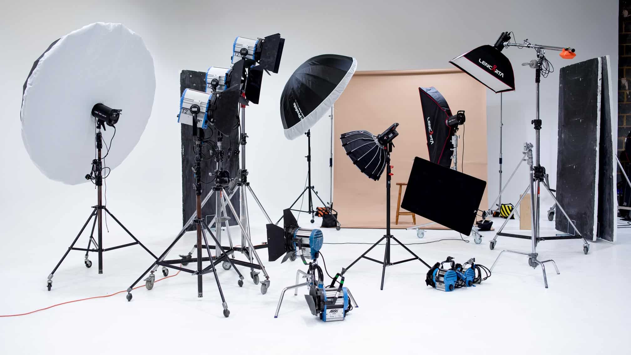 Professional photography studio with carefully arranged lighting and a refined portrait setup