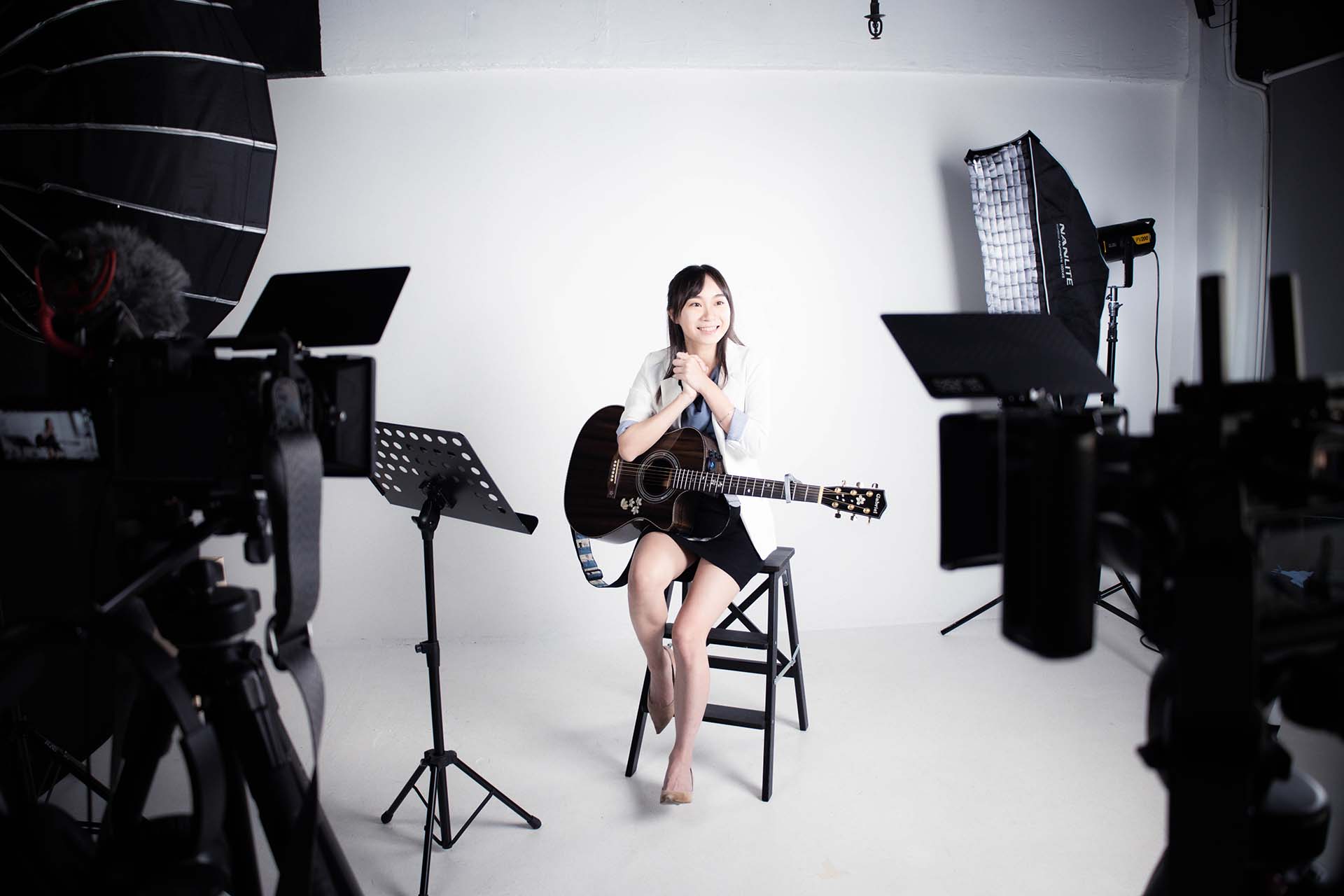 Creative portrait photography setup with professional studio lighting and camera equipment